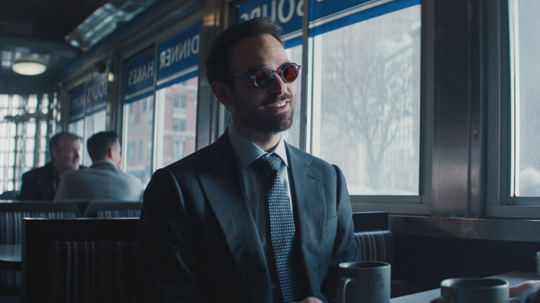 Matt Murdock smiling at a diner booth in Daredevil: Born Again