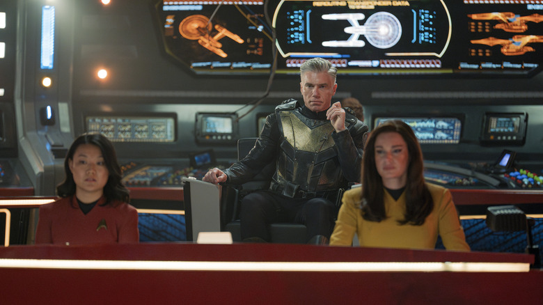 Rong Fu as Mitchell, Anson Mount as Pike, and Rebecca Romijn as Una in Star Trek: Strange New Worlds, episode 1, season 3, streaming on Paramount+, 2025