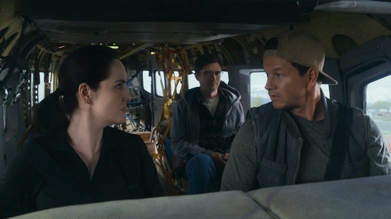 Madalyn and Daryl are in the cockpit while Winston watches from the back of Flight Risk