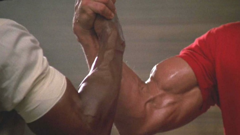 The famous handshake between Carl Weathers and Arnold Schwarzenegger
