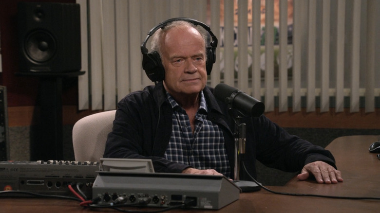 Frasier sits in front of the microphone in his radio booth at KACL