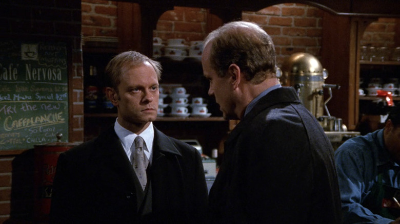 Niles and Frasier stand in Cafe Nervosa having a conversation