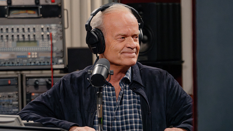 Frasier sits in front of the microphone in his radio booth at KACL