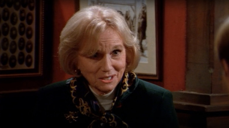 Eva Marie Saint as Joanna Doyle sitting next to each other at a table in Frasier