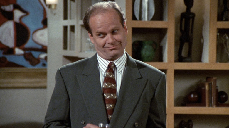 Kelsey Grammer's Frasier stands in his apartment in Frasier