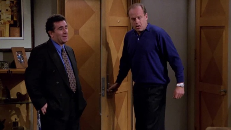 Saul Rubinek as Donny Douglas and Kelsey Grammer as Frasier Crane standing together in Frasier