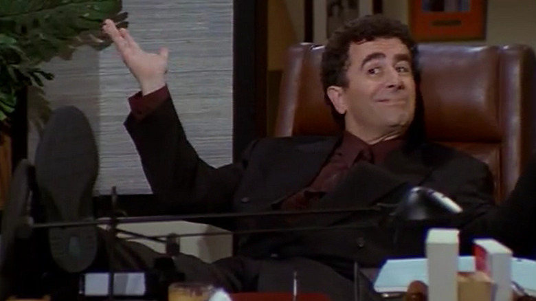 Saul Rubinek as Donnie Douglas, who sits at a table at Fraser's