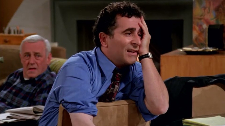 Saul Rubinek as Donnie Douglas looks annoyed