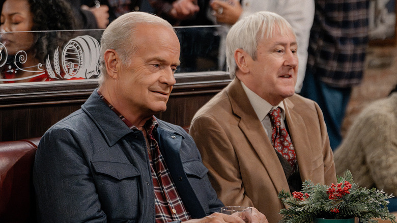 Frasier and Alan sit side by side in a bar looking despondent in Frasier