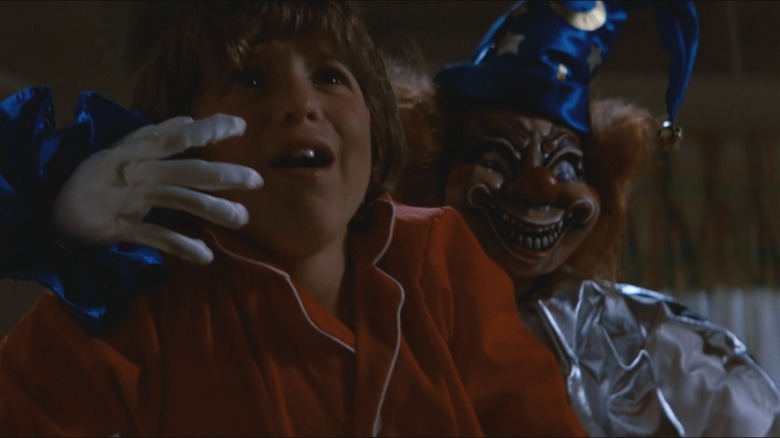 The clown gets Robbie in Poltergeist (1982)