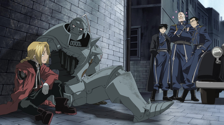 Edward and Alphonse Elric lying injured in an alley with Mustang Armstrong and Hughes looking on in Fullmetal Alchemist