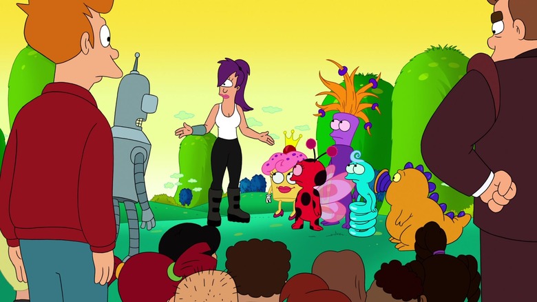 Leela stands next to several cute, kid-friendly creatures while Fry, Bender, and several orphans look on in Futurama