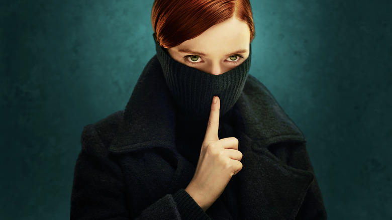 Dolours Price in a mask holding a finger up to suggest silence in the Say Nothing poster