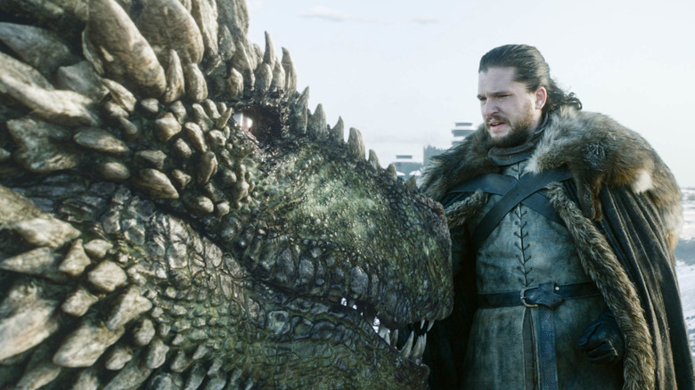 Jon interacting with a dragon on Game of Thrones