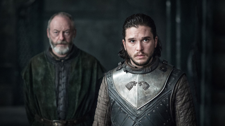 Jon in Stark armor looking forward with Davos behind him in Game of Thrones