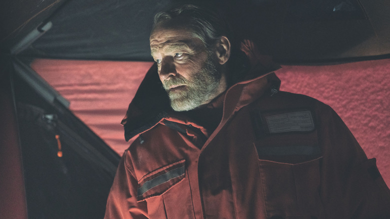 Iain Glen as Magnus looking concerned in The Rig