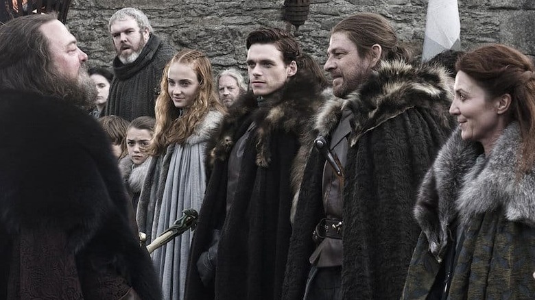 The Stark family greeting King Robert Baratheon on Game of Thrones