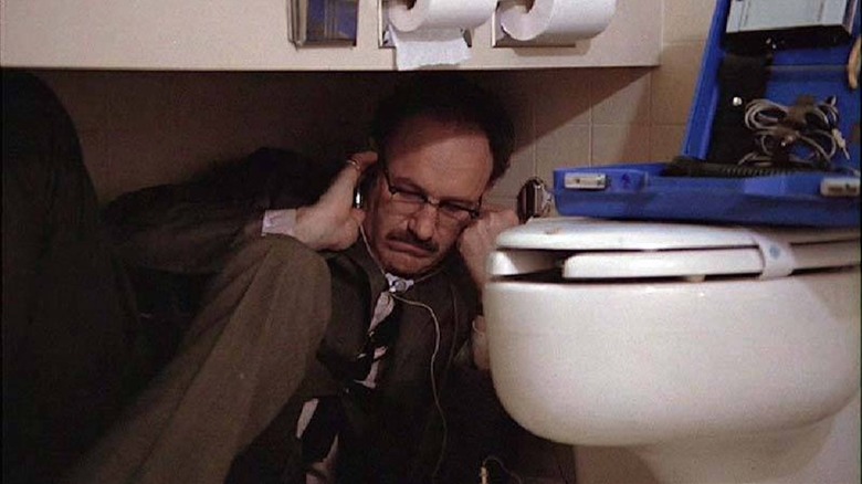 Gene Hackman's Harry Caul using a listening device in The Conversation