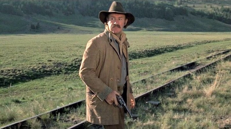 Gene Hackman brandishes a pistol as Sam Clayton in Bite the Bullet