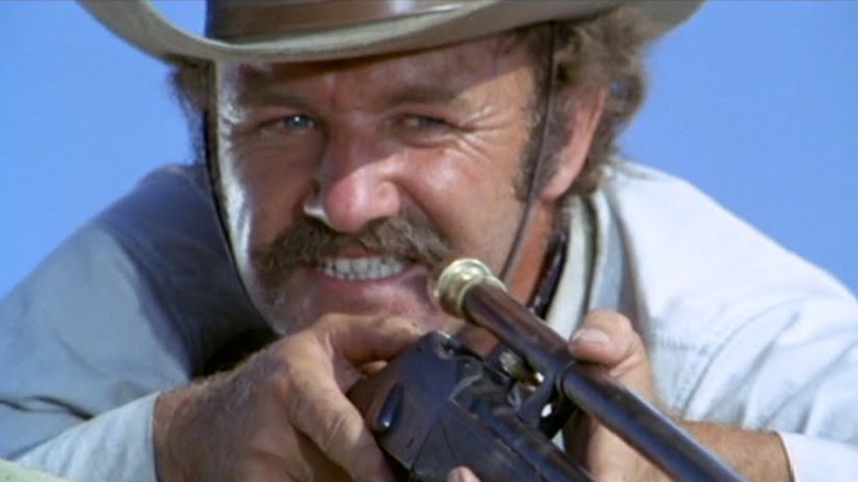 Gene Hackman takes aim with a high-powered rifle as Brandt Ruger in The Hunting Party