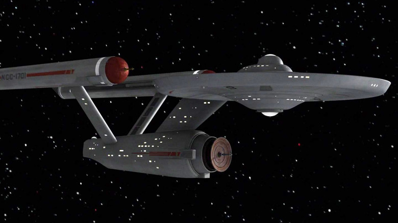 The U.S.S. Enterprise traveling through space in Star Trek: The Original Series