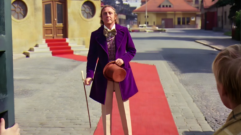 Willy Wonka carrying a walking stick