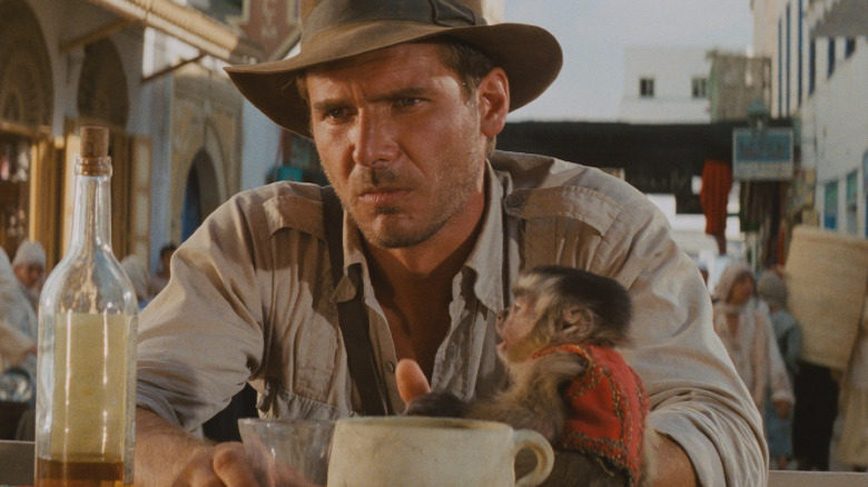 Indiana Jones with his monkey in Raiders of the Lost Ark