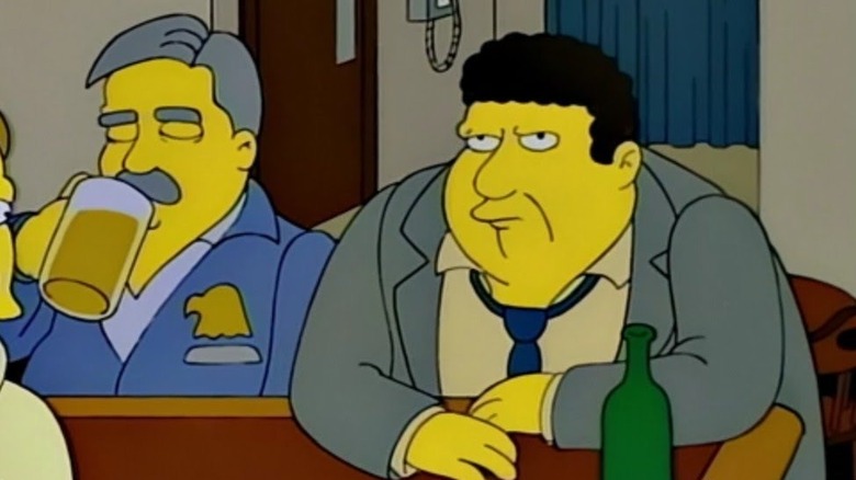 Geo﻿rge Wendt as Norm sitting at a bar on The Simpsons