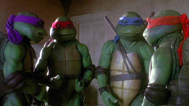Leif Tilden, Josh Pais, David Forman, and Michelan Sisti as Donatello, Raphael, Leonardo, and Michelangelo converse in Teenage Mutant Ninja Turtles