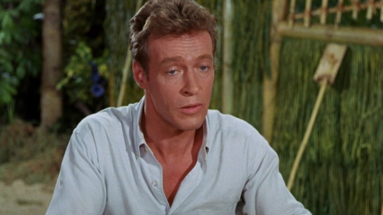 Russell Johnson as the Professor is wearing a white shirt on Gilligan's Island