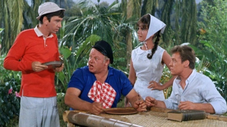 Russell Johnson as the Professor and other castaways are at the table on Gilligan's Island