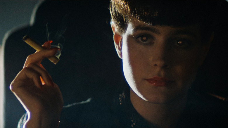 Sean Young as Rachael holding a cigarette in Blade Runner