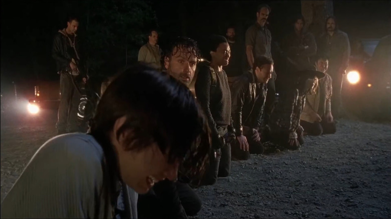 Rick and the rest of his gang reacting to Glenn's death in The Walking Dead episode The Day Will Come When You Won't Be