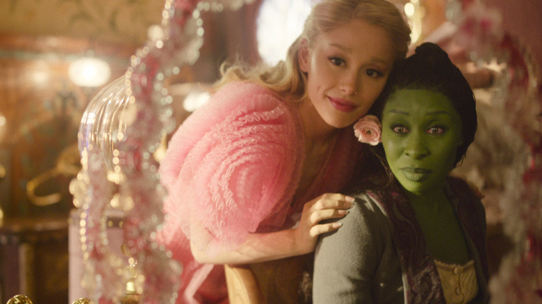 Cynthia Erivo's Elphaba and Ariana Grande's Glinda looking in the mirror in Wicked