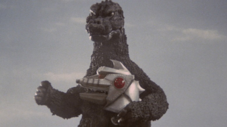 Godzilla hugging Mechagodzilla's head