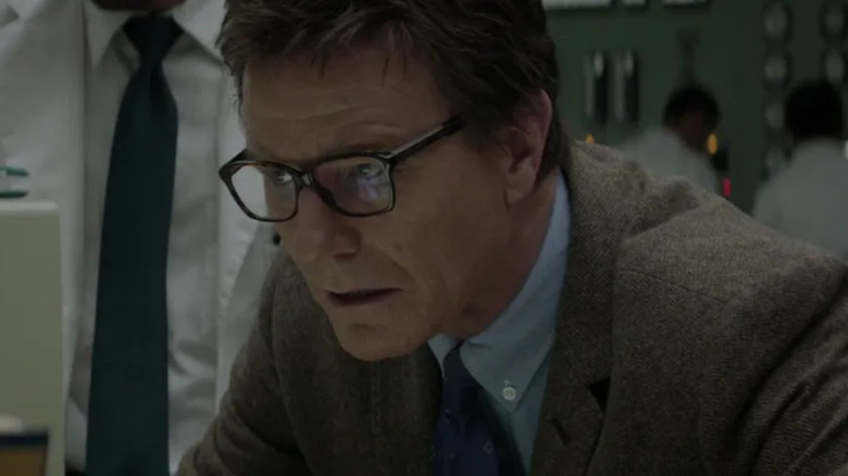 Joe Brody (Bryan Cranston) looks at a computer desk in Godzilla (2014)