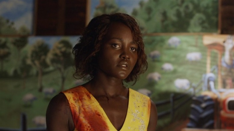 Lupita Nyong'o bloody yellow dress in Little Monsters