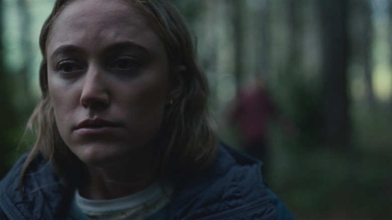 Maika Monroe in the woods in Significant Other