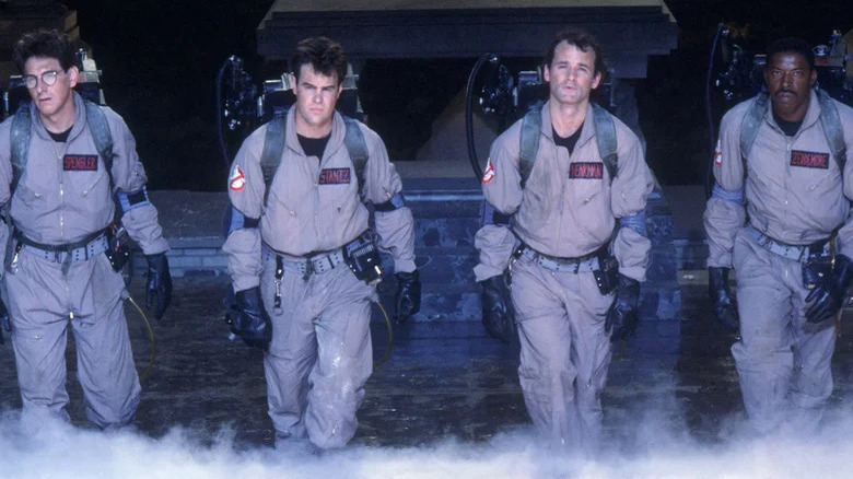 The main actors in Ghostbusters in their outfits