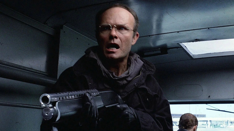 Kurtwood Smith holding large gun in Robocop