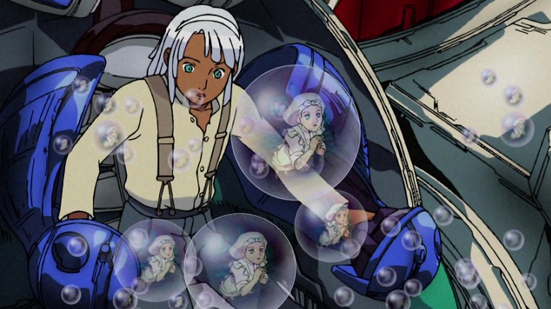turn a gundam loran in cockpit surrounded by bubbles