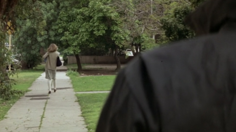 Michael watches Laurie walk down the street in Halloween 1978