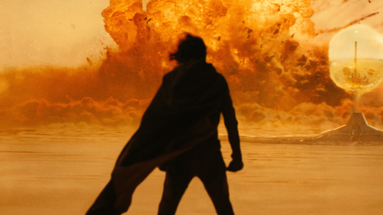 Paul Atreides looking at an explosion on the 70MM IMAX poster for Dune: Part Two