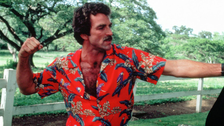 Tom Selleck throwing a punch in Magnum P.I.