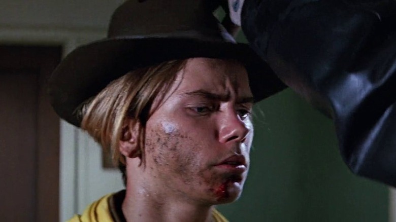 River Phoenix as Young Indy getting his hat in Last Crusade
