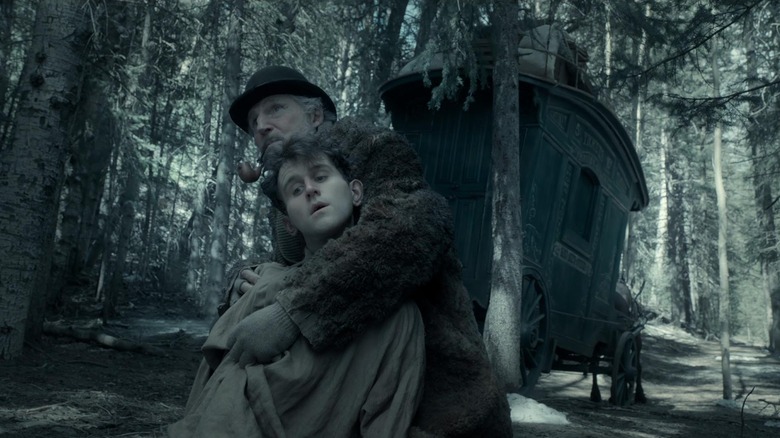 Liam Neeson and Harry Melling in The Ballad of Buster Scruggs