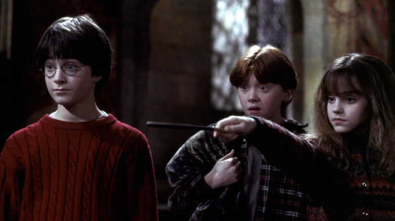 Daniel Radcliffe, Rupert Grint, and Emma Watson star in Harry Potter and the Sorcerer's Stone