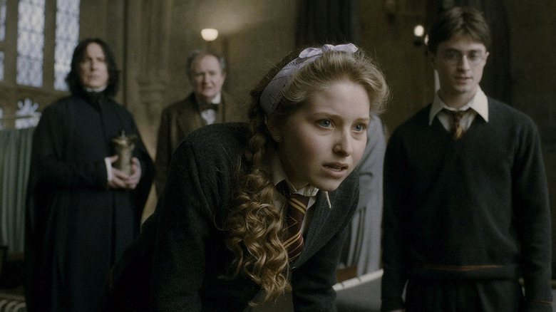 Jessie Cave as Lavender Brown looks concerned in the hospital wing of Hogwarts as Harry Potter, Snape and Slughorn observe in the background