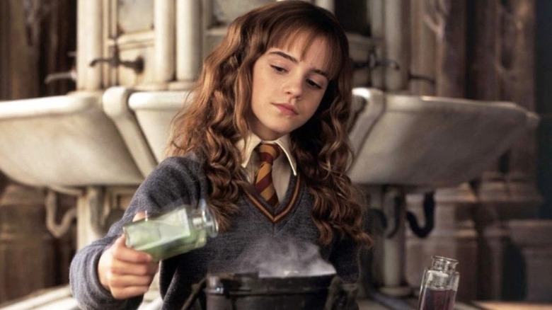 Hermione pours a potion