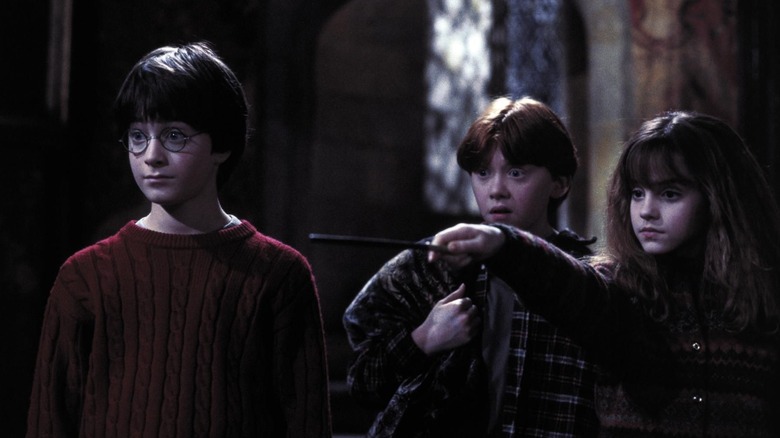 Harry and oil are standing at Hermeyun when it moves the knife in Harry Potter and the magician stone.